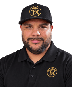 Markell Taylor wearing a black T&K polo and embroidered cap